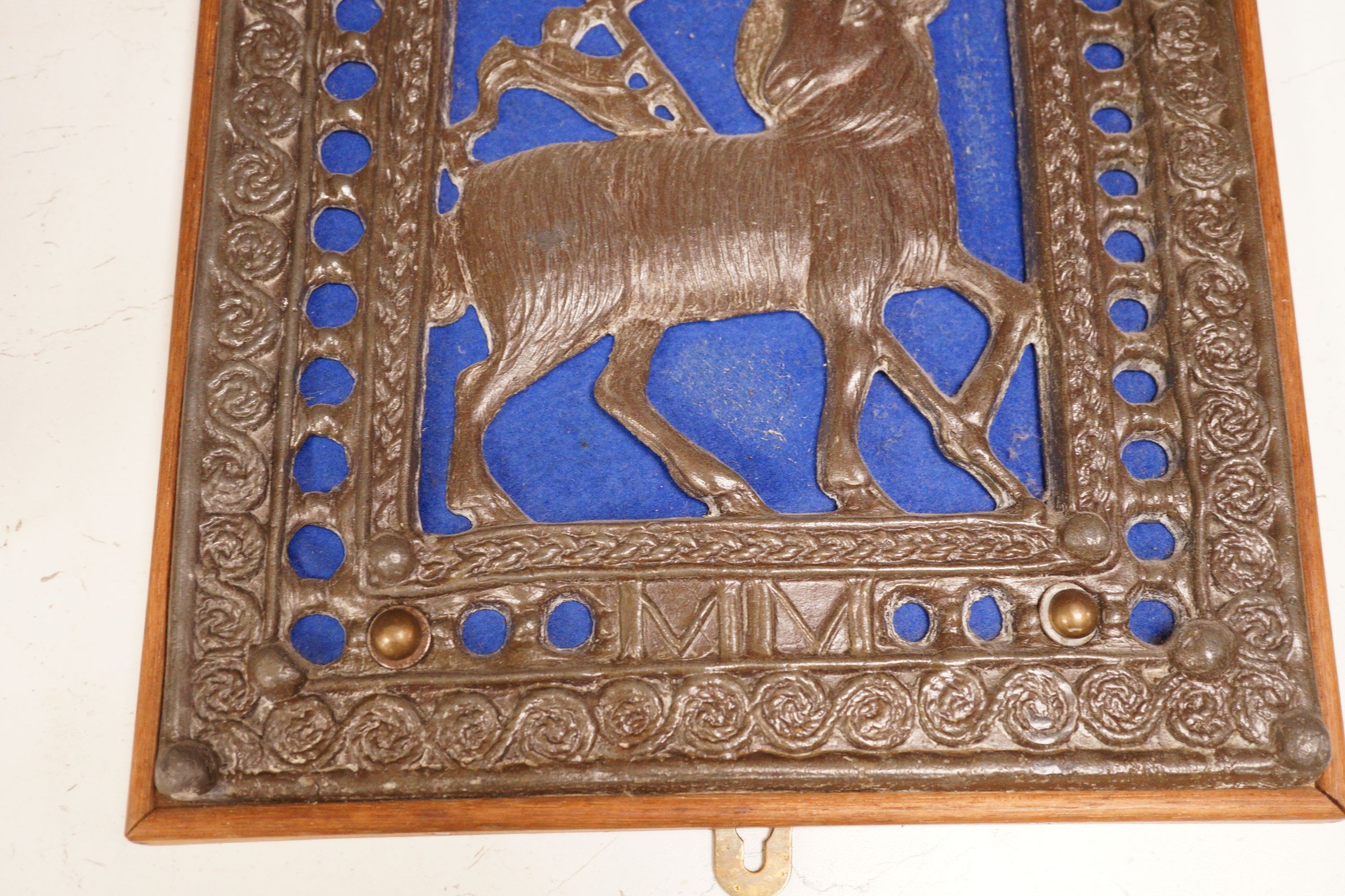 A wall mounted Lamb of God cast metal panel, 31 x 29cm